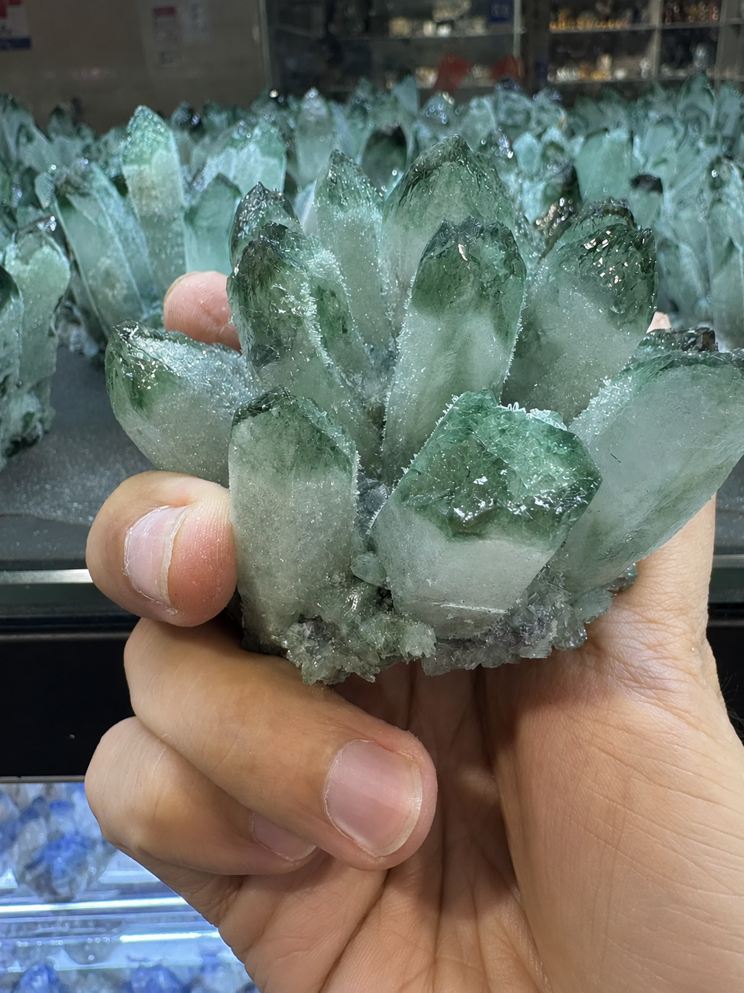 Raw green quartz crystal cluster with emerald-tipped points