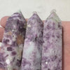 Video of small lepidolite tower rotating in light